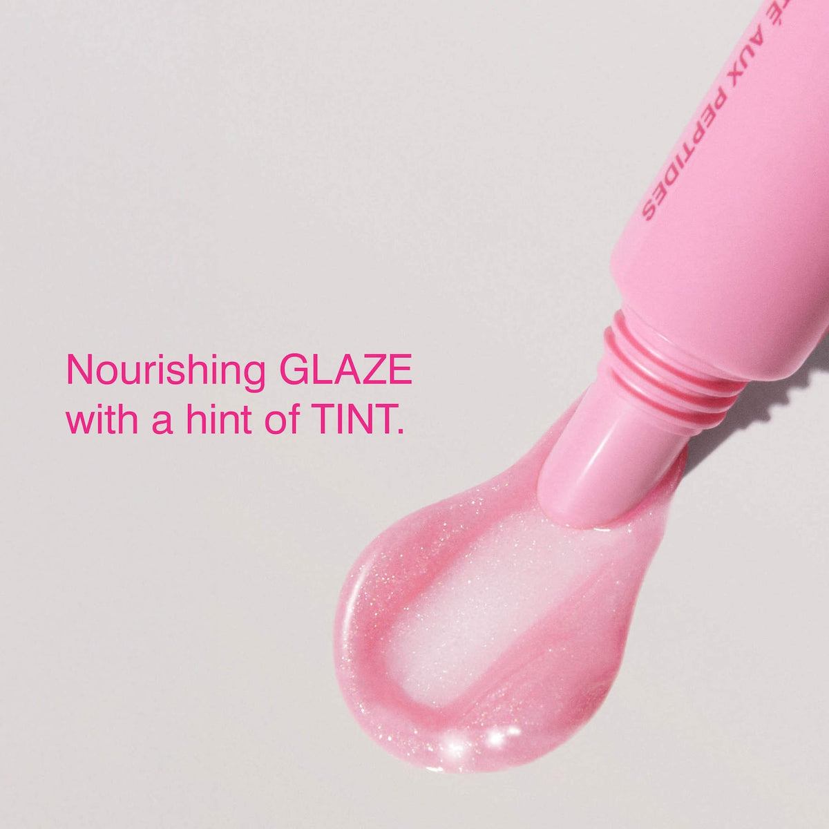 Rhode Peptide Lip Tint Nourishing Glaze - Jelly Bean - shimmery sheer baby pink + sweet